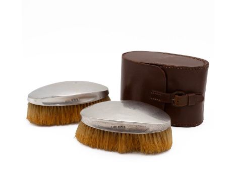 Pair of silver backed brushes in original fitted leather travelling case, hallmarked Birmingham 1913, maker W &amp; F Rabone 