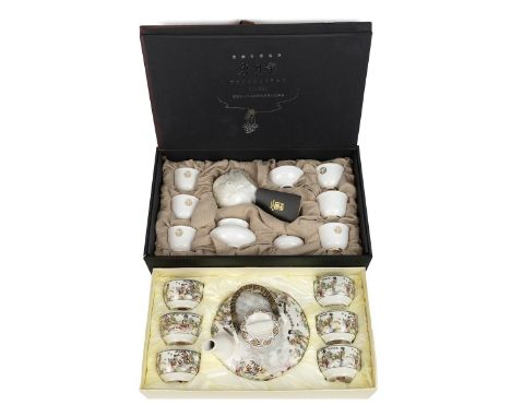 Chinese tea sets: a Tangyeyao Chisel boxed set of 6 tea bowls, teapot, strainer, stand and jug in white with gilt footrim and