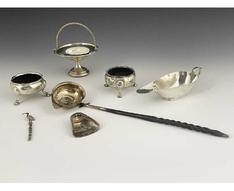 A George III punch ladle, with turned handle, the silver bowl inset with a coin, hallmarked London 1810, sponsor's mark rubbe