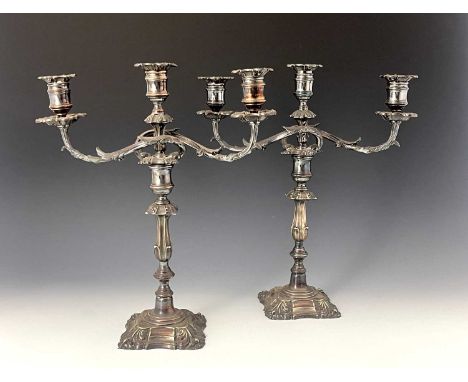A pair of Victorian plated three-light candelabra, modelled in the late eighteenth-century style, each with foliate scroll br