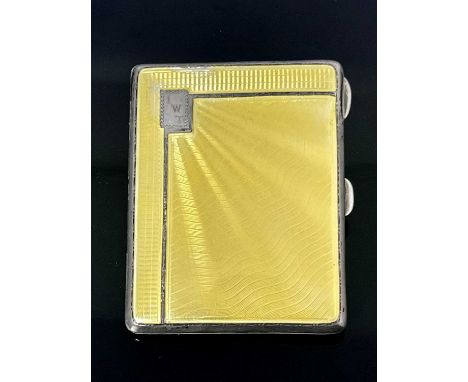 A George V Art Deco silver guilloche enamel cigarette case, the body with engine turned decoration and the cover with yellow 