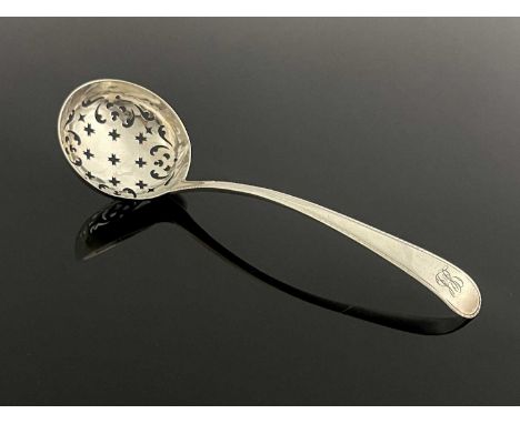 A George III silver Old English with feather edge pattern ladle, with a circular pierced bowl, initialled, possibly "LS", Geo