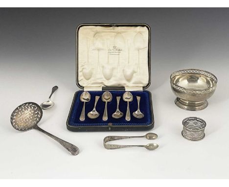 A group of hallmarked silver to include a George III silver Old English pattern sifter ladle, with bright cut decoration, the