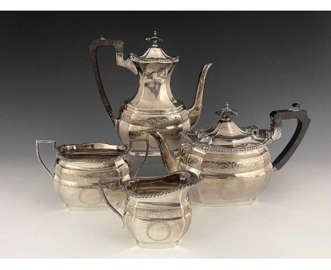 A twentieth century plated four-piece tea and coffee service, comprising coffee pot, teapot, both with ebonised wooden handle