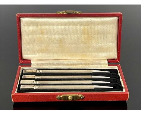 A cased set of four Art Deco silver bridge propelling pencils, with engine turned decoration and twist mechanism to advance t