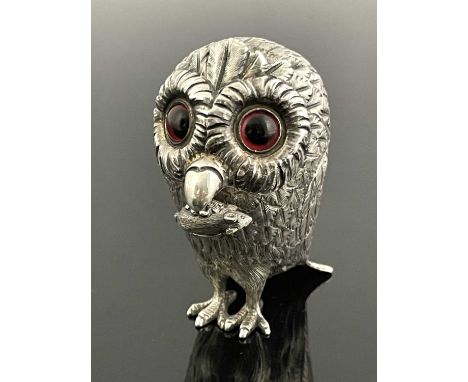 A Victorian silver novelty mustard pot, modelled in the form of a standing owl, the body with textured feathers and red glass