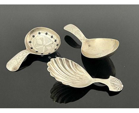 A George III silver tea caddy spoon, with bright cut decoration, the bowl with star cut piercing, Joseph Taylor, Birmingham 1