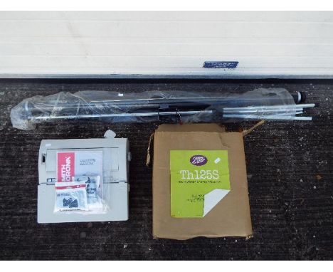 A projector screen, boxed projector and a Smith Corona word processing typewriter. [3]