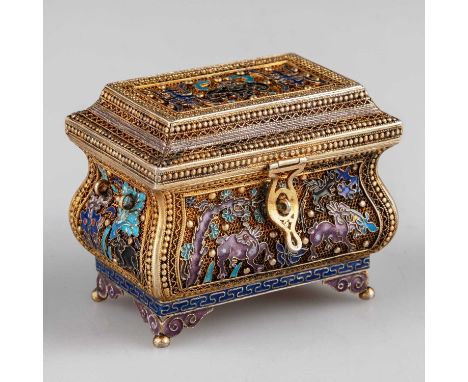 A CHINESE SILVER AND ENAMEL CASKET, EARLY 20TH CENTURY of rectangular bombe form with hinged cover, decorated with beasts, ba