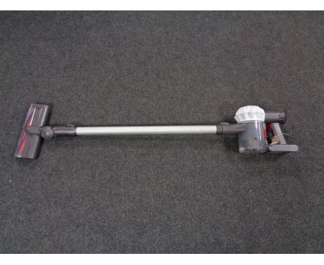 A Dyson V6 cord free electric vacuum together with a box of wall mounting bracket, accessories and charger 