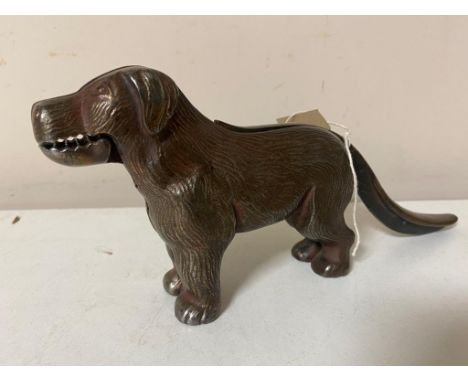 A vintage metal nut cracker in the form of a dog 