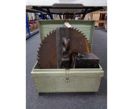 An early twentieth century tin trunk containing two heavy duty saw blades, block plane and ammunition crate 