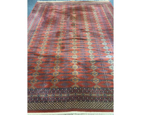 An Afghan design carpet, 410cm by 303cm