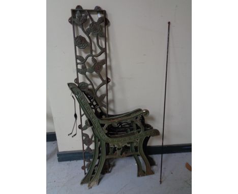 Two pairs of cast iron bench ends together with a cast iron bench back panel 