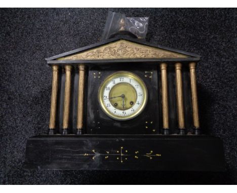 A Victorian slate gilt highlighted mantel clock with pendulum and key 