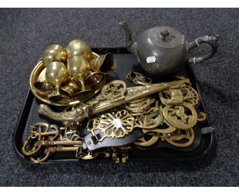 A tray of assorted brass ware, keys, horse brasses, goblets on tray, antique pewter teapot 