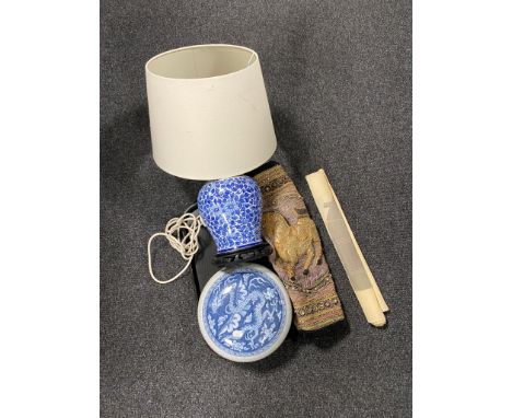 A tray of oriental blue and white table lamp on wooden base, blue and white crackle glazed pot, Indian beaded tapestry etc 