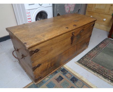 An antique oak metal bound shipping trunk CONDITION REPORT: Locked and without a key. 122cm long by 58cm deep by 58cm high. W