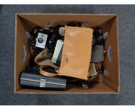 A box of vintage cameras and camera bags 