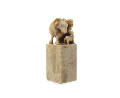 20TH CENTURY CHINESE HARDSTONE SEAL , with goat finial, carved to base, 11cm high