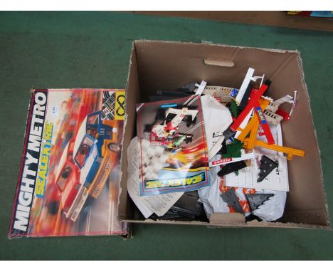 A boxed Scalextric Mighty Metro set and a box of track and accessories 