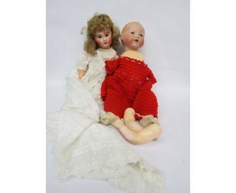 An Armand Marseille 351 bisque head baby doll on jointed compostion body and a French bisque doll (a/f) 