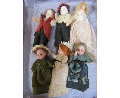 Six bisque head dolls house dolls 