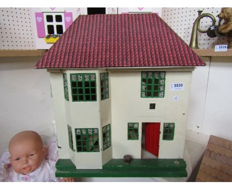 A vintage two storey dolls house 