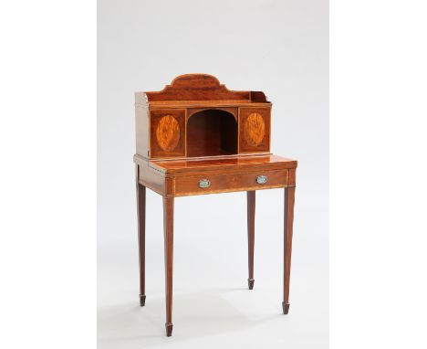 A FINE SATINWOOD BANDED MAHOGANY BONHEUR DU JOUR, the superstructure with a pair of cupboard doors flanking an arched recess,
