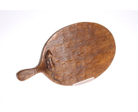 ROBERT THOMPSON OF KILBURN
AN EARLY MOUSEMAN OAK CHEESEBOARD, carved mouse signature to the oval board, rich colour. 31.5cmTh