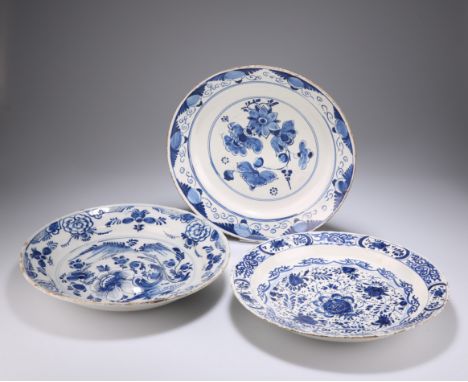 AN 18TH CENTURY DELFT BLUE AND WHITE ALMS DISH, painted with foliage; together with TWO 18TH CENTURY DELFT BLUE AND WHITE CHA
