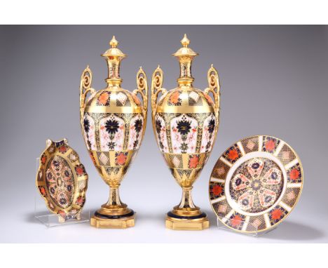 A GROUP OF ROYAL CROWN DERBY IMARI, comprising a large pair of pedestal vases, c.1952-75, with fixed 'covers', (one vase base