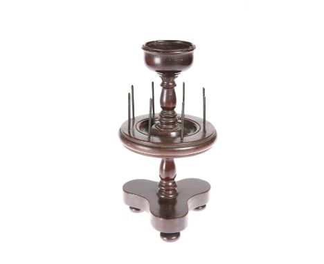 A VICTORIAN MAHOGANY BOBBIN STAND, CIRCA 1860, with trefoil base. 27cm high