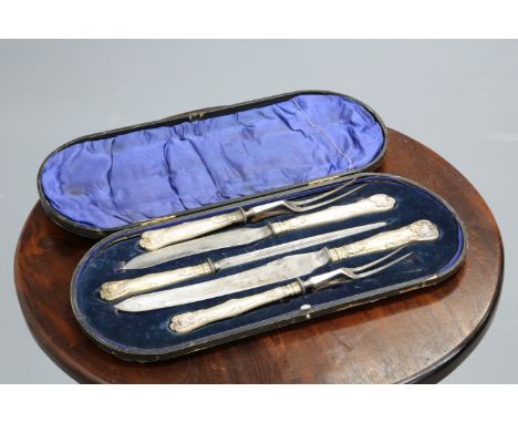 ~ AN EDWARDIAN SILVER-HANDLED FIVE-PIECE CARVING SET,&nbsp;by&nbsp;George Howson, Sheffield 1902, in a fitted box.