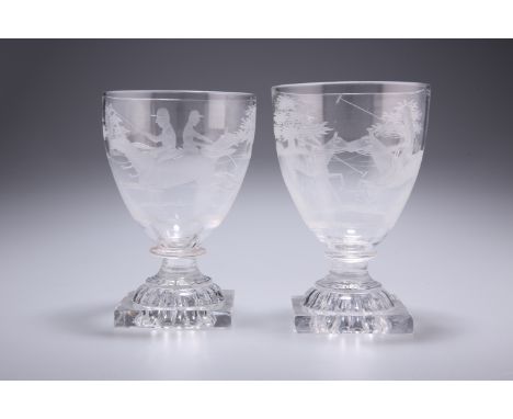 A PAIR OF 19TH CENTURY GLASS RUMMERS, each etched with polo players, raised on square lemon-squeezer foot. 13.5cmThe absence 