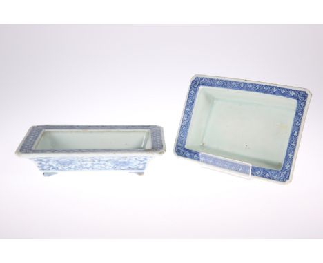 A NEAR PAIR OF CHINESE BLUE AND WHITE PLANTERS, rectangular with bracket feet, the exteriors painted with lotus flowers and s
