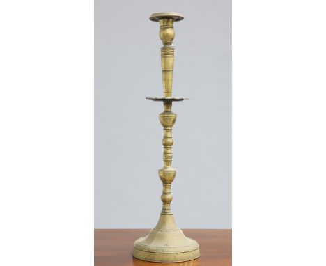 ~ A LARGE 18TH CENTURY BRASS CANDLESTICK,&nbsp;with domed base and knopped baluster stem. 68.5cm high