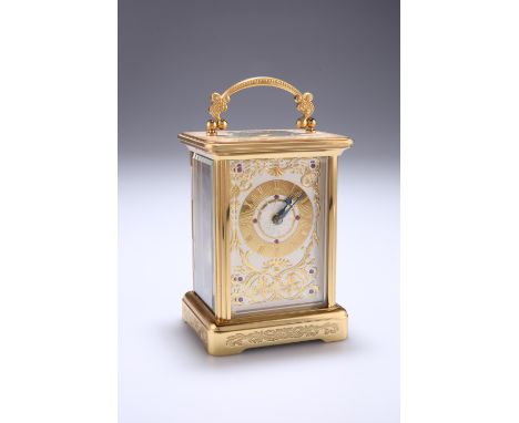A 20TH CENTURY GILT METAL CASED CARRIAGE CLOCK, SIGNED IGOR CARL FABERGE, the fancy silvered dial with gilt Roman numeral cha