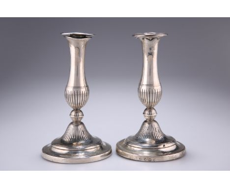 A PAIR OF GEORGE III CAST SILVER CANDLESTICKS,&nbsp;by John Green, Roberts, Mosley &amp; Co, Sheffield 1802, of tapered balus