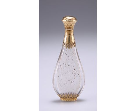 A MID 19TH CENTURY FRENCH GOLD MOUNTED ROCK CRYSTAL SCENT BOTTLE, of slim tapering oval form with pierced and engraved decora