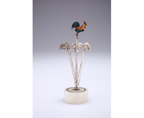 AN ART DECO SILVER, ENAMEL AND ONYX COCKTAIL STAND,&nbsp;by&nbsp;C B &amp; S, London 1927, the carousel form stand with malac