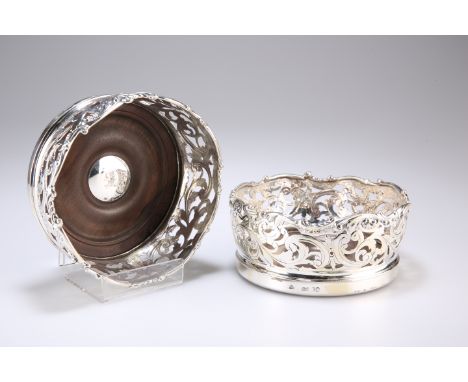 A PAIR OF VICTORIAN SILVER HUNT &amp; ROSKELL BOTTLE COASTERS,&nbsp;by John Samuel Hunt, London 1845, each of circular form w