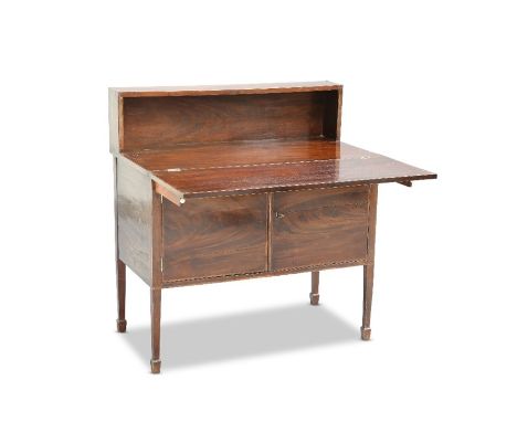 A GEORGIAN MAHOGANY DESK CABINET, with shelf back above a foldover top over a pair of banded cupboard doors, raised on square