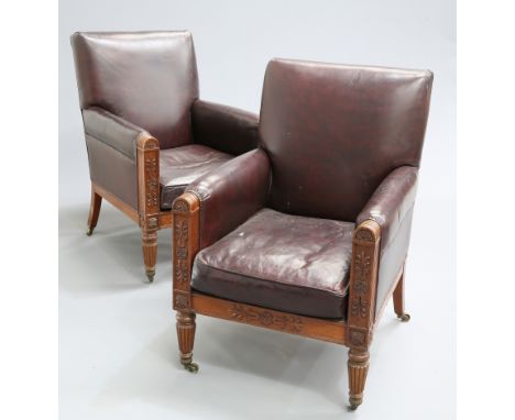 ~ A PAIR OF MAHOGANY AND LEATHER UPHOLSTERED LIBRARY BERGERES, FIRST HALF 19TH CENTURY,&nbsp;each with rounded uprights carve