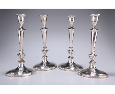 A SET OF FOUR GEORGE III SILVER CANDLESTICKS, John Parsons &amp; Co., Sheffield 1789,&nbsp;tapering knopped stems with fluted