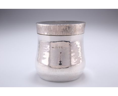 A SILVER TEA CADDY, by Graham Whatling, London 1974,&nbsp;baluster form with lightly hammered decoration, the concave pull-of