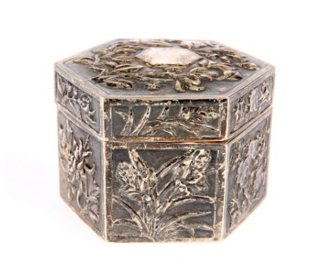 A CHINESE SILVER BOX AND COVER, CANTON, CIRCA 1880, octagonal, decorated in relied with foliage, maker's mark MK and characte