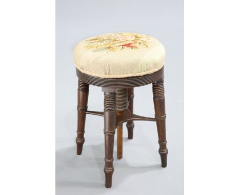 A 19TH CENTURY MAHOGANY ADJUSTABLE PIANO STOOL, with circular seat, raised on four splayed ring-turned legs; together with A 