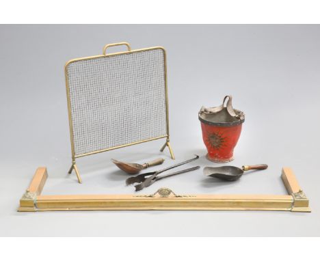 A COLLECTION OF COUNTRY HOUSE FIRESIDE ARTICLES, comprising a leather fire bucket, brass firescreen, fender, tongs and two sh