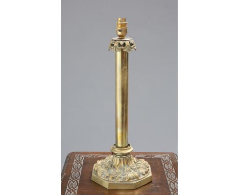 A BRASS COLUMNAR TABLE LAMP, 19TH CENTURY, with boldly cast octagonal base.
